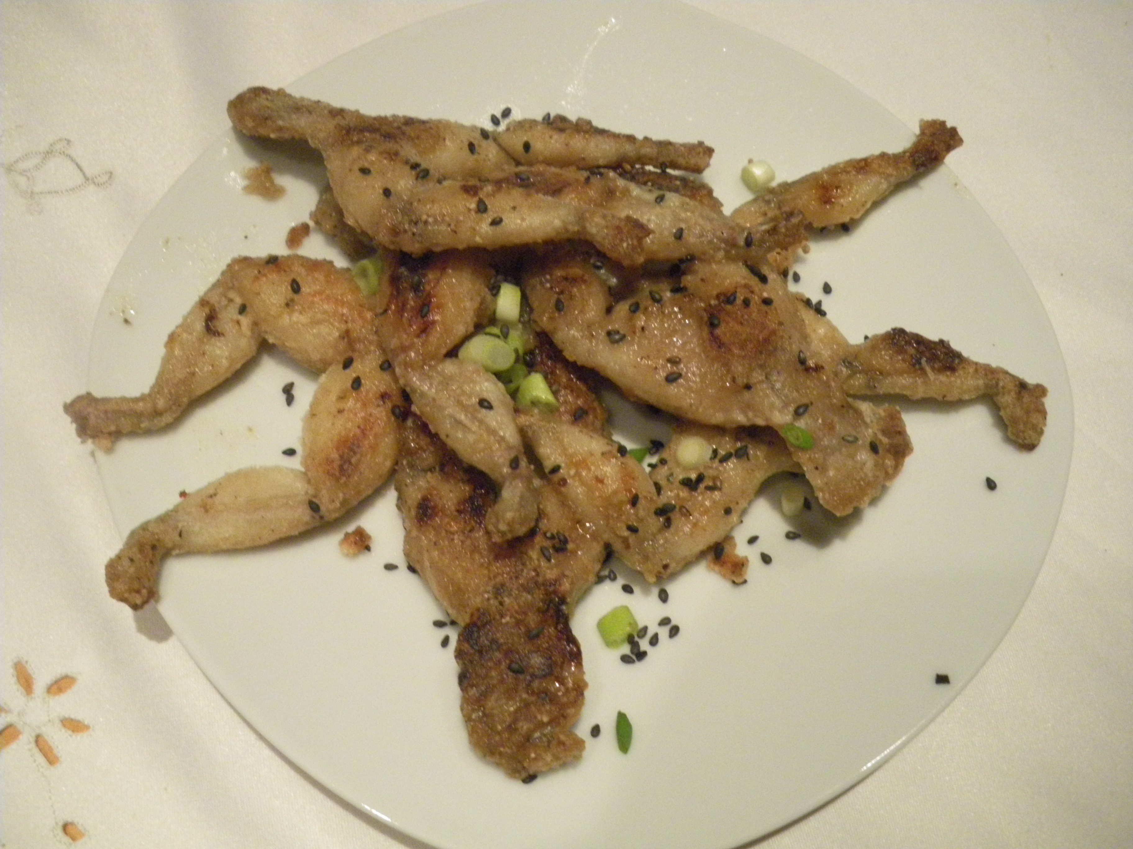 Frog legs. Frog Legs dish. Cooked Frogs. Florida Frog Legs. French Restaurant Frogs Legs.
